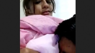 Indian girl enjoys oral sex on her breasts
