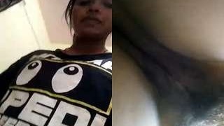 Tamil girl flaunts her large breasts and vagina