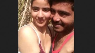 Indian couple enjoys intimate moments in open field