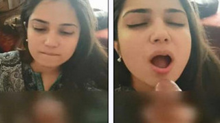 Pakistani amateur fellatrix gets lost in the moment while sucking on a big cock
