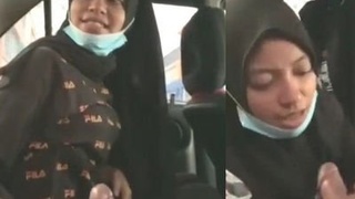 Desi girl in hijab gives quick blowjob and gets fucked in the backseat
