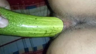 Indian babe uses cucumber to satisfy her sexual desires