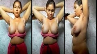 Desi girl with huge natural breasts strips naked in the bathroom