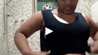 A Tamil woman undresses in the bathroom and sends a MMS video