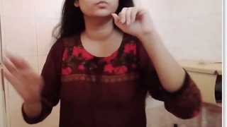 Desi bhabhi's solo bathroom striptease in a video clip