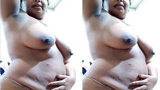 Indian bhabhi takes a bath and shows off her curves