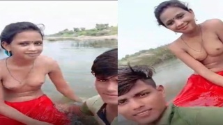 Desi girl in swimsuit takes selfies while swimming in the pool