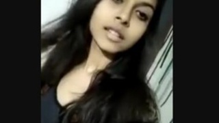 Watch a stunning woman strip down to nothing in a seductive dance