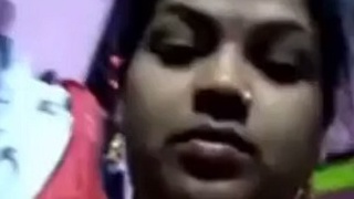 Watch a mature Indian woman undress in a solo video