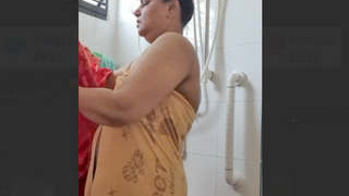 Indian BBW aunty soaps up in the shower