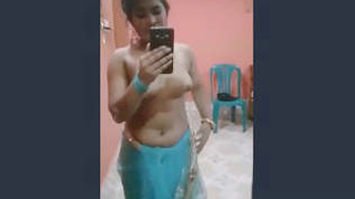 Erotic video of a beautiful girl seductively removing her saree and revealing her body to her partner