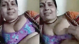 A mature Indian couple indulges in steamy romance on a live video call