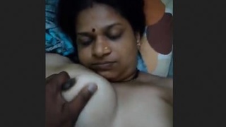 Watch this sexy aunty in the nude and record her big boobs