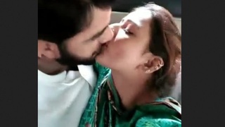 Pakistani couple gets intimate in the back seat of a car