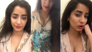 Desi girl with big boobs talks to fans while masturbating