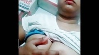 Watch a young Desi girl with perky boobs in action