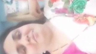 Busty Indian auntie strips down and teases in sari video
