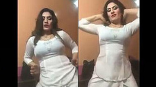 Chubby aunty in a tight dress shakes her booty on FB Live