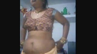 Indian wife flaunts her breasts and pussy in a video