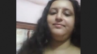 Busty Indian bhabhi flaunts her breasts and pussy