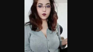 Watch a busty girl flaunt her large breasts