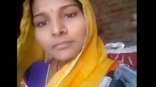 Desi babe with a cute face and perky tits masturbates in a village