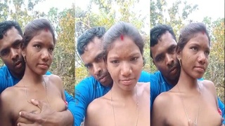 Tribal wife's big boobs on display in outdoor sex video