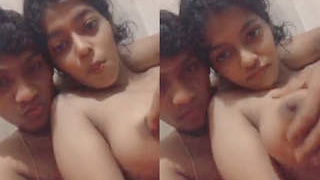 Indian guy teases a girl's small boobs on camera