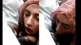 Arab hijab-clad woman gives blowjob in car